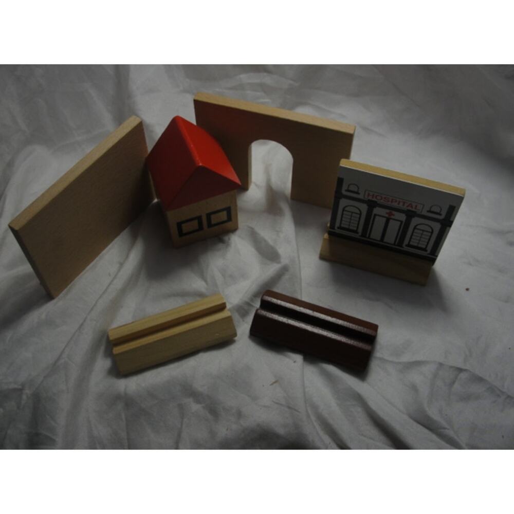 Lot of wooden train set accessories.